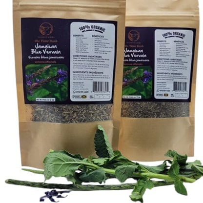 Two packages of Inspired Gems Jamaican Blue Vervain Tea standing upright behind a pile of fresh green vervain stalks on a white background