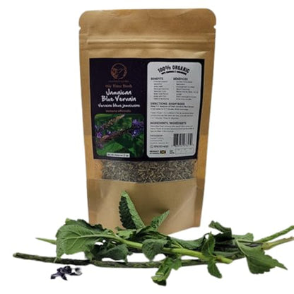 A single brown kraft paper pouch of Inspired Gems Organic Jamaican Blue Vervain Tea standing behind fresh, long green vervain leaves on a white background